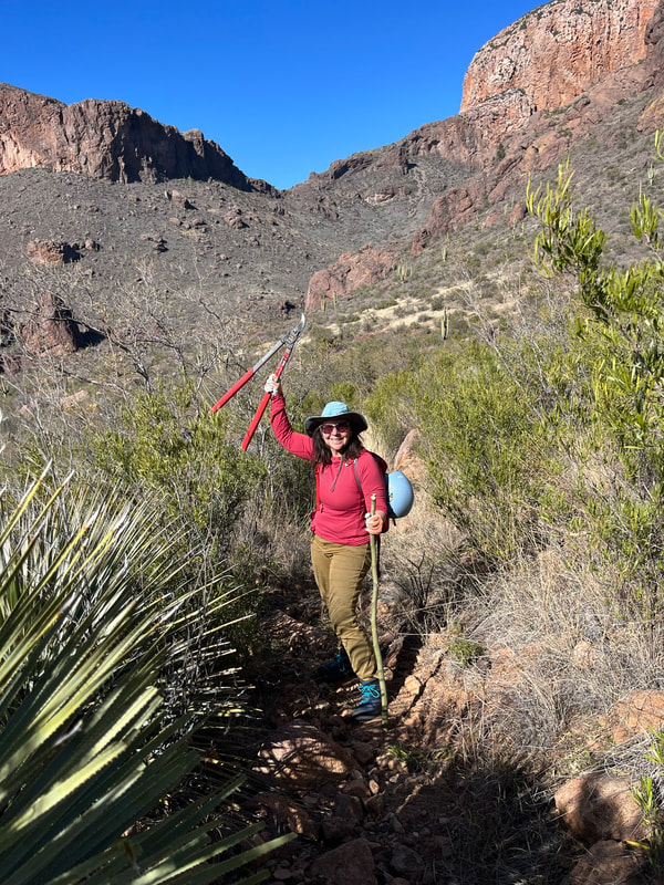 Ann Ranalli, CASA Secretary, wielding a set of loppers for trimming branches