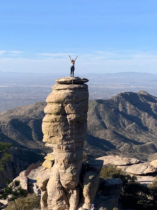 HONORABLE MENTION:  An honorable mention goes to photographer Andy Harrison for this photo, which captures climber Julianna Gordon celebrating her first time climbing outdoors on Mount Lemmon